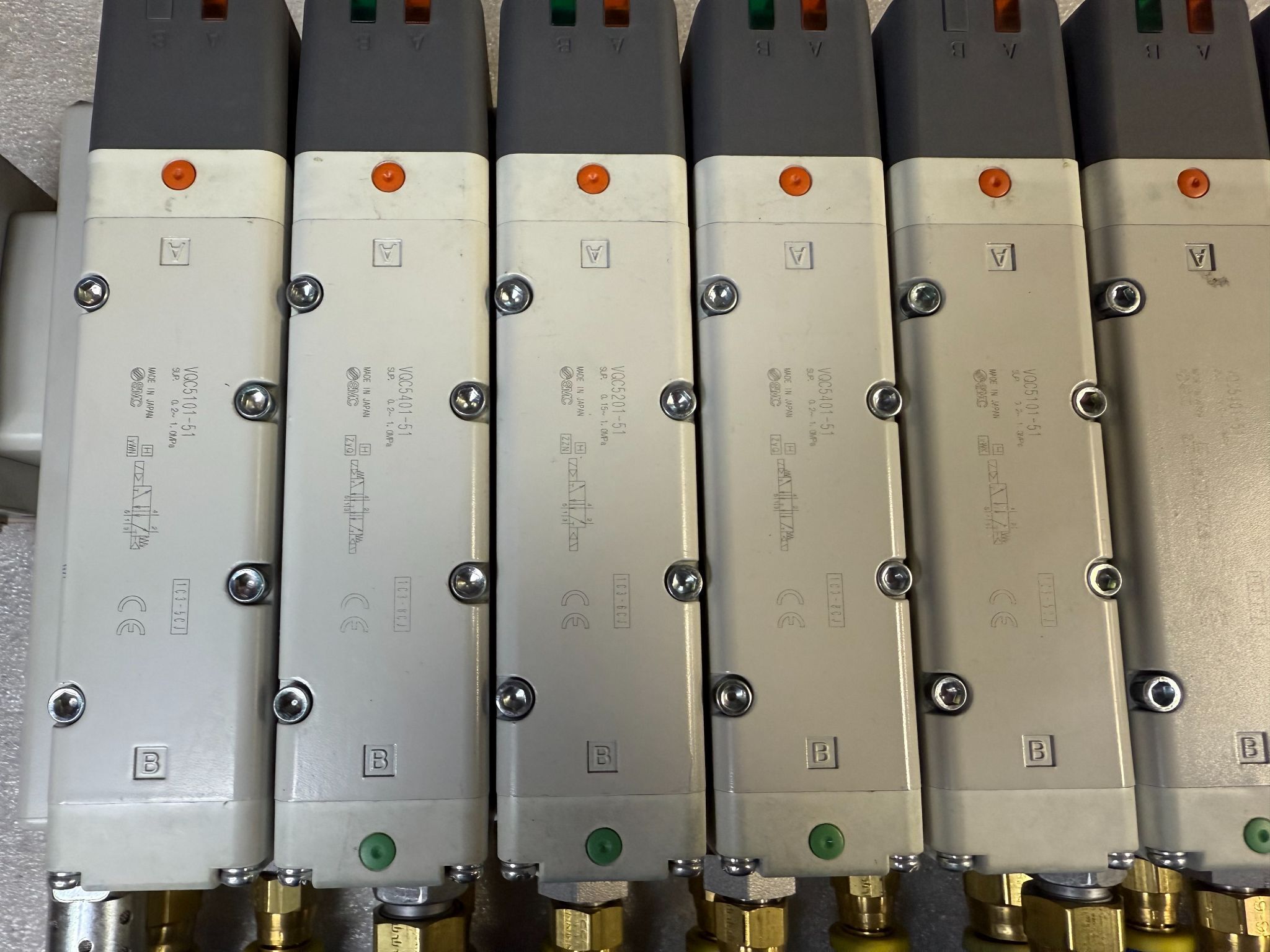 SMC VV5QC51-1204TSKAN VQC Manifold w/ (2) VQ5101-51, (4) VQ5201-51, (3) VQ4201-51 Solenoid Valves USED 1